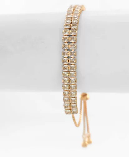 Aranyszínű antiallergén karkötő fehér kristályokkal