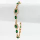 Aranyszínű antiallergén karkötő smaragdzöld kristályokkal