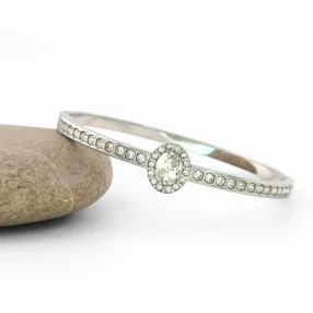 Ezüstszínű nemesacél karperec fehér kristályokkal