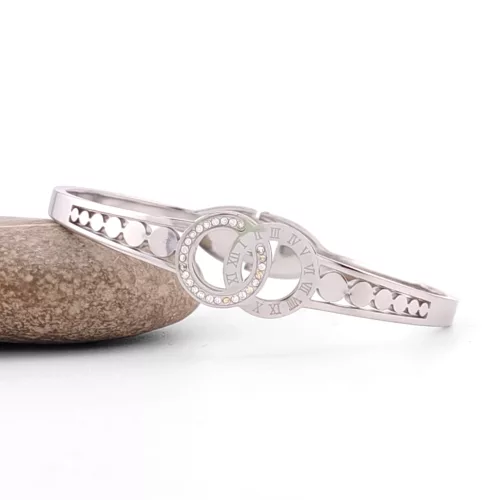 Ezüstszínű nemesacél karperec fehér kristályokkal