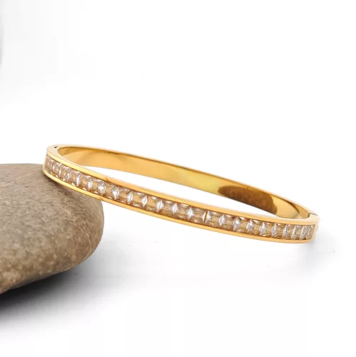 Aranyszínű nemesacél karperec fehér kristályokkal