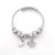 Ezüstszínű nemesacél pandora jellegű karperec szív charmokkal