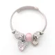 Ezüstszínű nemesacél pandora jellegű karperec szív charmokkal