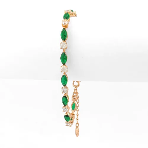 Aranyszínű antiallergén karkötő smaragdzöld kristályokkal