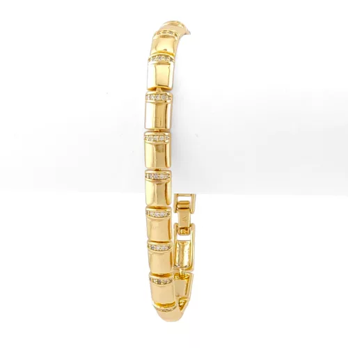 Aranysárga színű antiallergén karkötő fehér kristályokkal