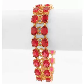 Aranyszínű antiallergén karkötő bordó kristályokkal