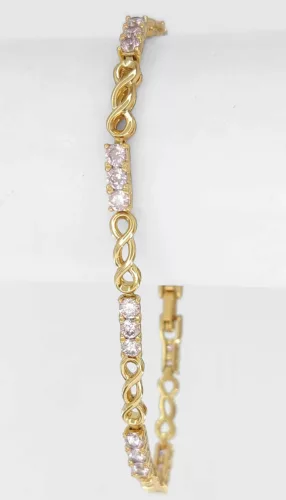 Aranyszínű antiallergén karkötő rózsaszín kristályokkal